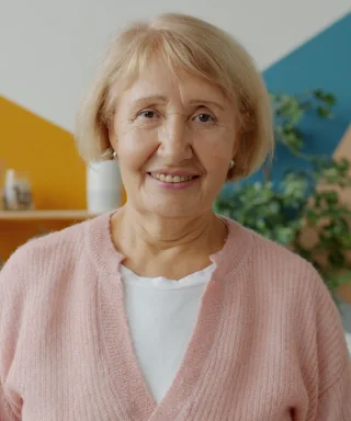 Sample portrait of a smiling older woman at home